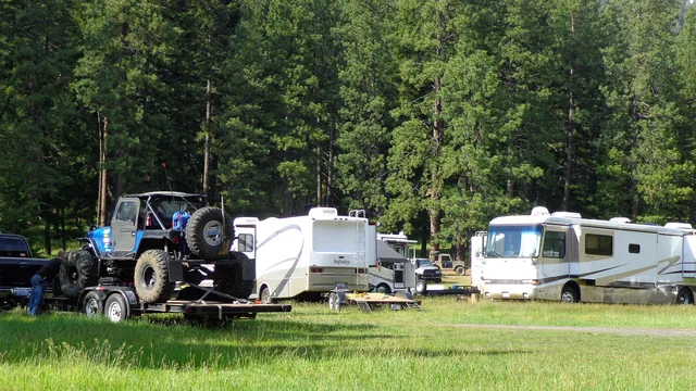 Three different kinds of rig parked side by side at a Bureau of Land Management recreation site — a Class A motorhome, a fifth wheel and a travel trailer.